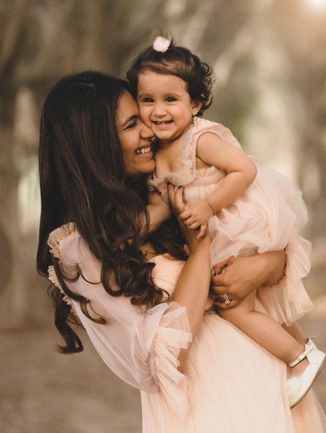 Family session outdoor ,mom carrying her daughter